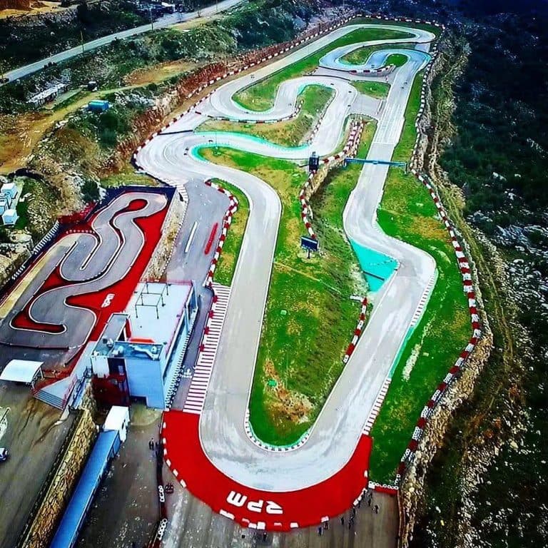 The full circuit seen from above, its kerbs picked out in red, green and blue against the hillside